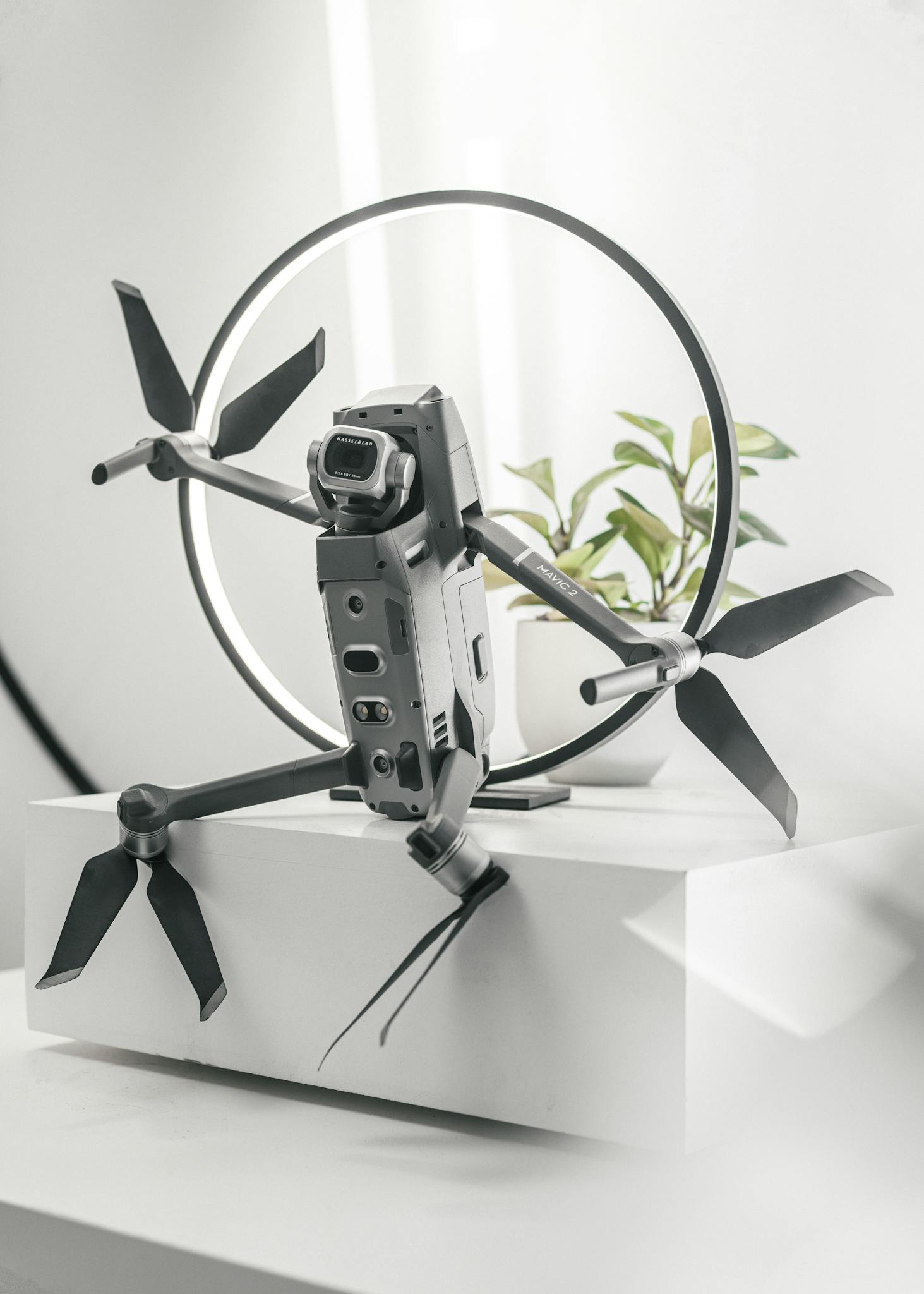 Close-up view of a futuristic drone with a ring backdrop, showcasing modern technology.